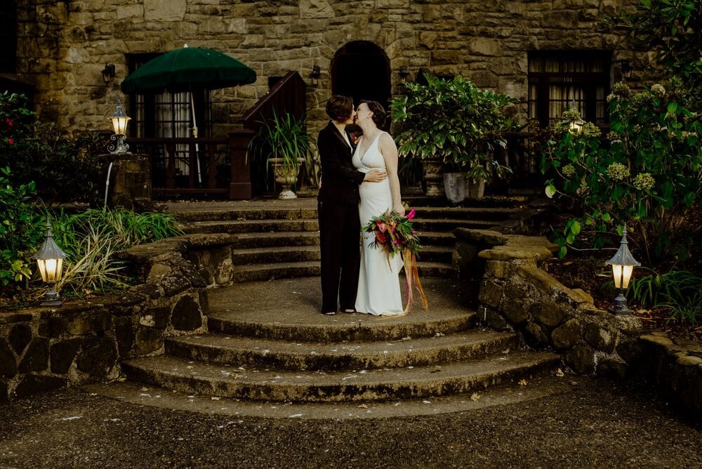 Two brides on the steps of the Benbow Inn near Garberville, California