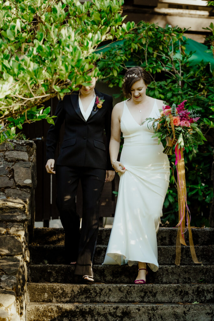 Two brides descend the stairs at Benbow Inn in Humboldt County