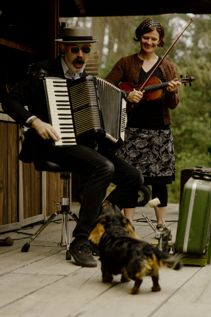 Black and tan puppy howls along with Rainy Day Picnic band at Humboldt Bay Social Club - Oyster Beach
