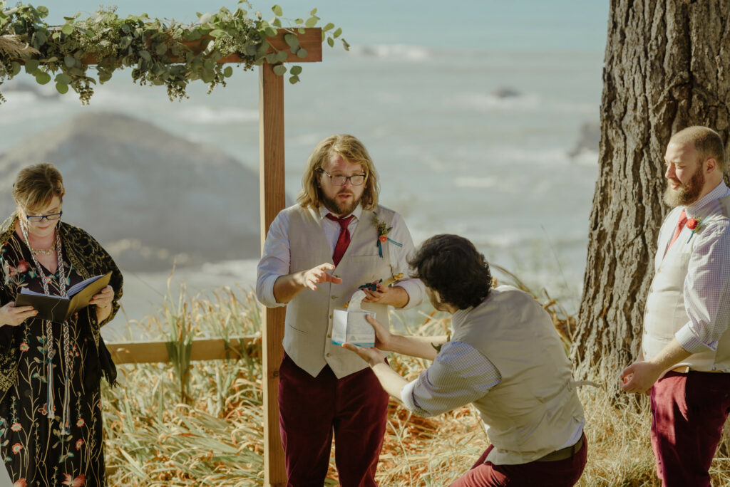 Groomsman hands tissue to tearful groom during Northern California wedding ceremony