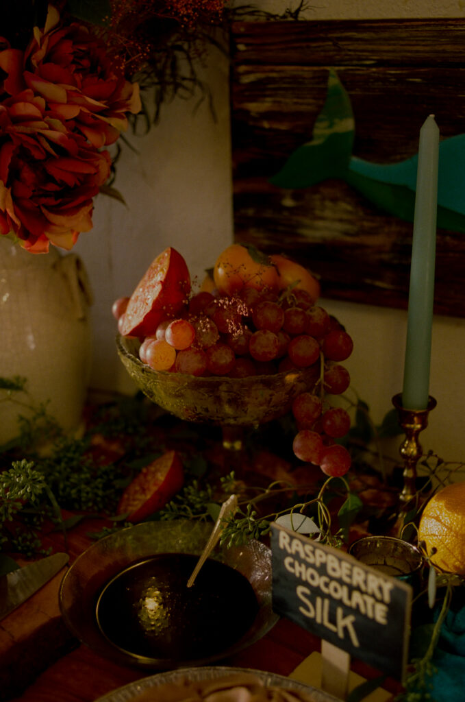 Pomegranate and grape desert table setting at Lost Whale Inn wedding in Trinidad, California