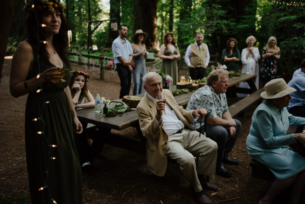 Grandfather toasts the newlyweds at a Northern California redwoods destination wedding