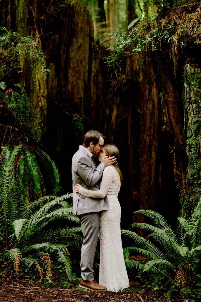 Couple embrace after redwood elopement ceremony in Prairie Creek Redwoods