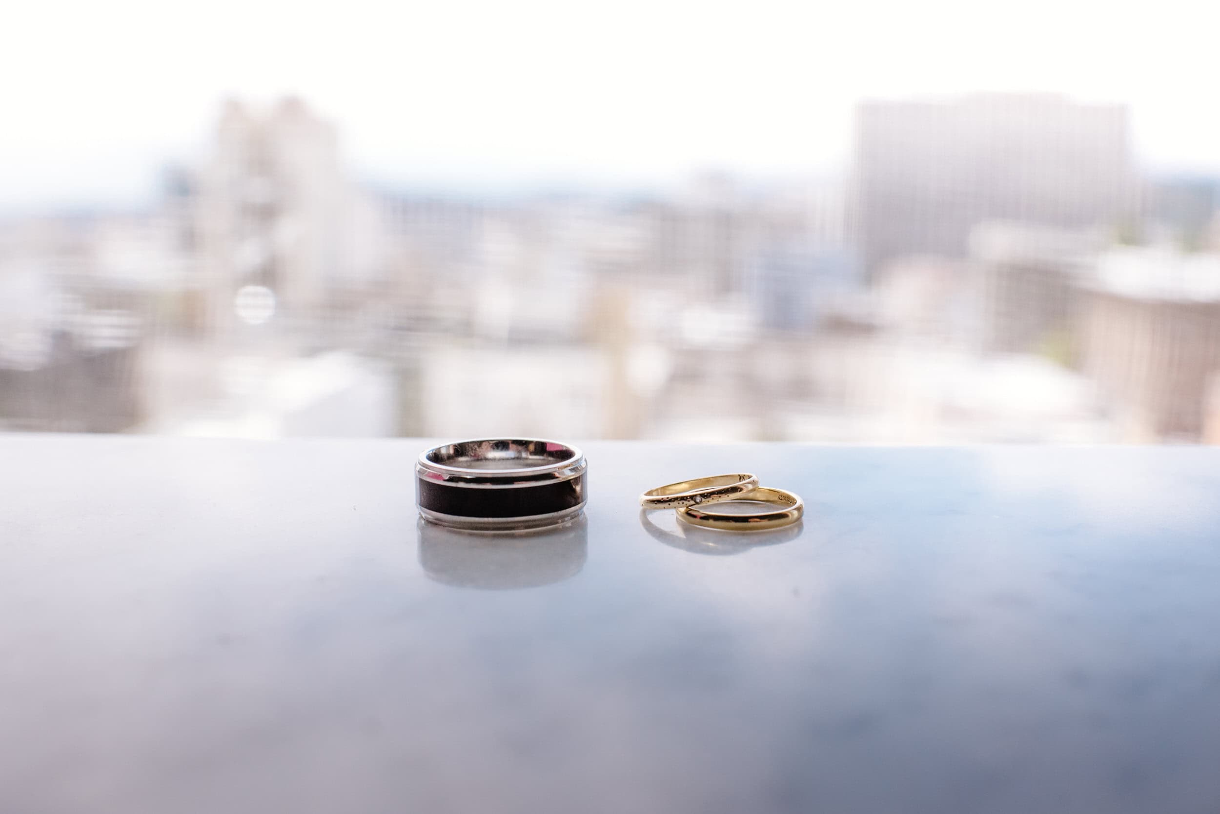 Wedding rings with San Francisco skyline in the background