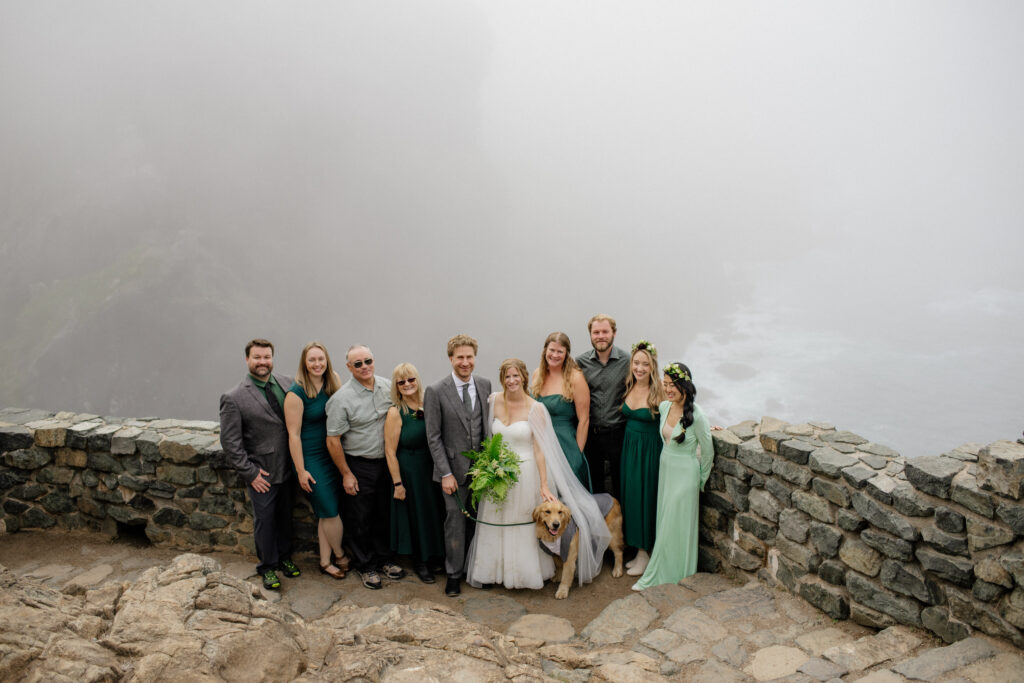 Group wedding portrait at the top of Wedding Rock at Sue Meg State Park in Northern California.